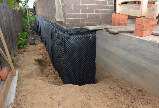 Happy homeowners after waterproofing job in Mottville